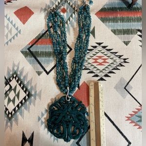 Carved boutique piece in amazonite with many strands and sterling extender.